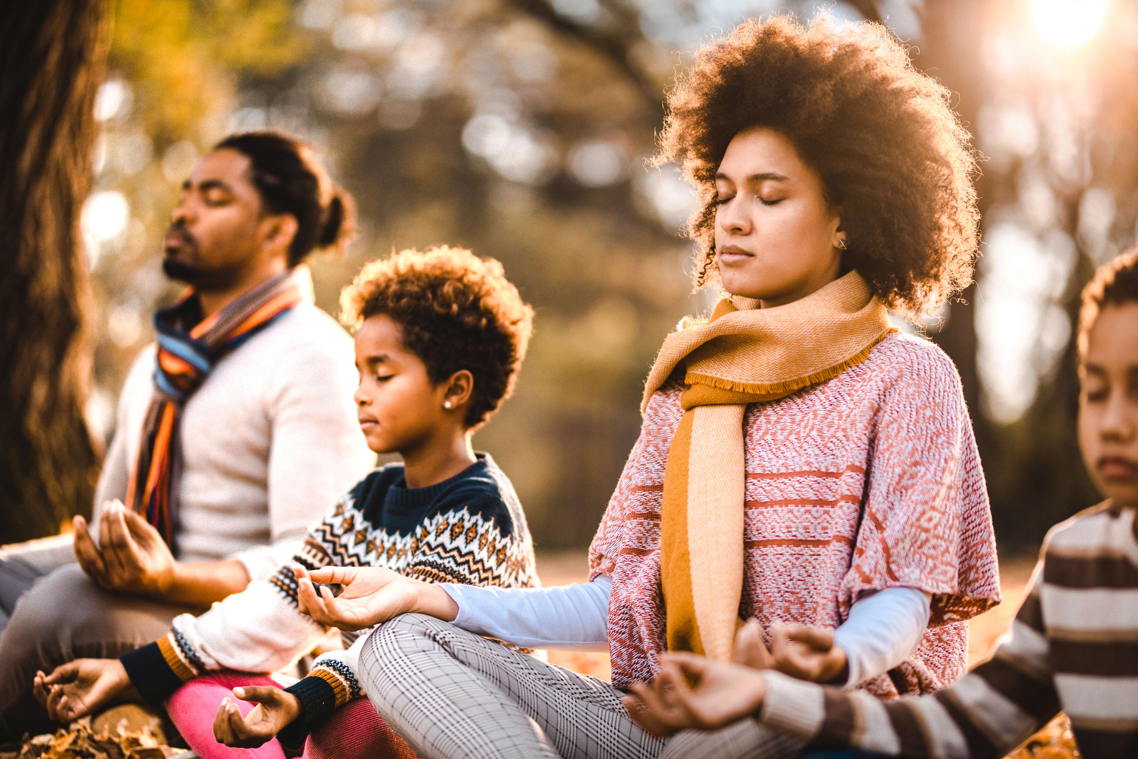 family practicing meditating